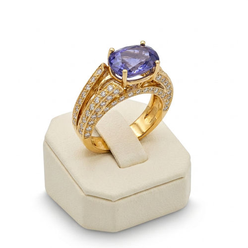 4.00 Carat Oval Cut Tanzanite And 1.00 Carat Round Cut Diamond 18kt Yellow Gold Ring