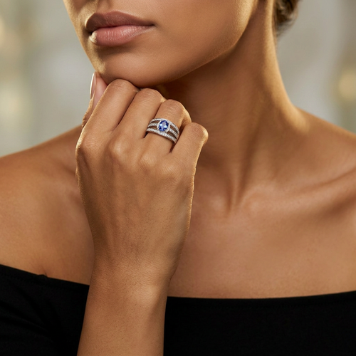 .90 Carat Oval Cut Tanzanite And .50 Carat Round Cut Diamond 14kt Three Row Ring