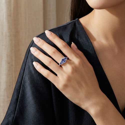 Oval And Pear Cut Tanzanite And .11 Carat Diamond 14kt Three Stone Ring